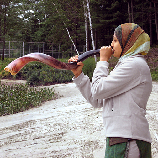 Muslim Youth Leader Blows a Shofar During a Jewish Education Activity