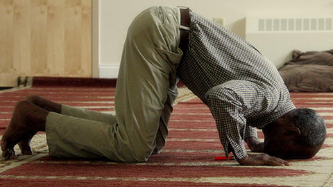Muslim man Performing Salah