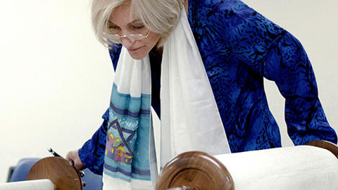 Woman reading the Torah
